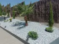 Jardines con piedras blancas y plantas exóticas, como palmeras y cipreses, crean un oasis moderno.