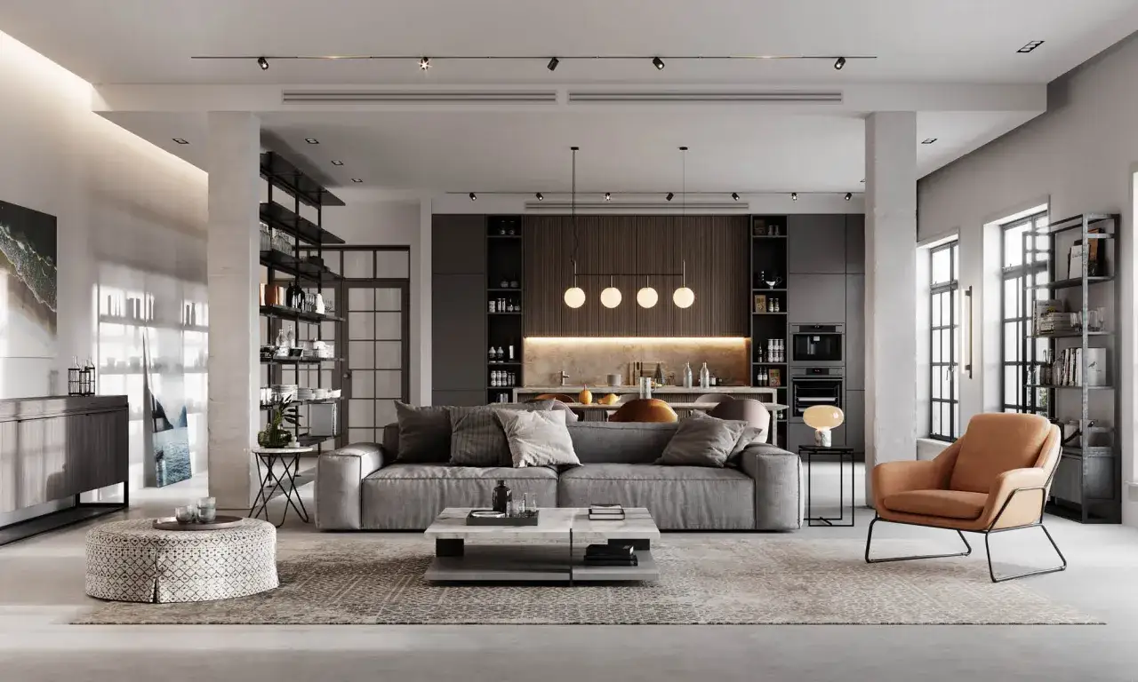 Sofá gris, mesa de centro moderna y sillón naranja en un salón con iluminación indirecta que crea un ambiente acogedor.