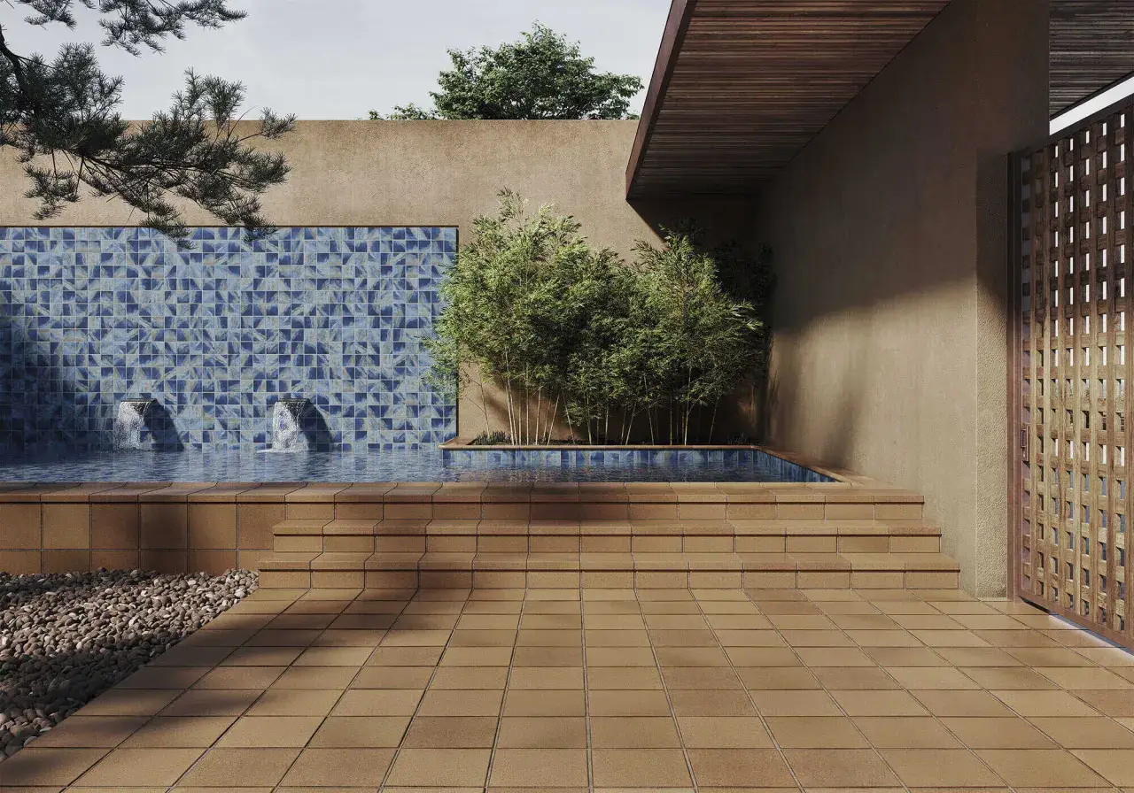 Elegantes suelos para patios exteriores modernos con piscina, cascadas y vegetación.